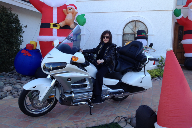 Daisy Monzo in 2012 on her motorcycle
